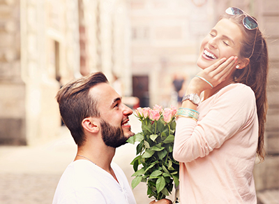 Engagement photo featuring urban backdrop