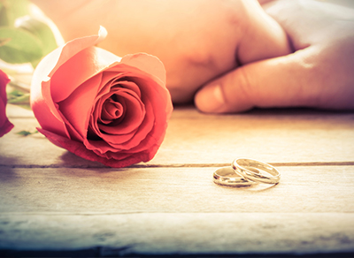 Close-up of couple holding hands during engagement shoot