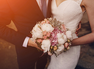 Bride and groom with a beautiful bouquet