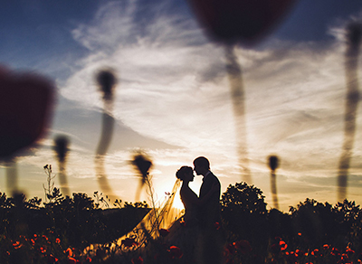 Couple embracing during sunset photoshoot